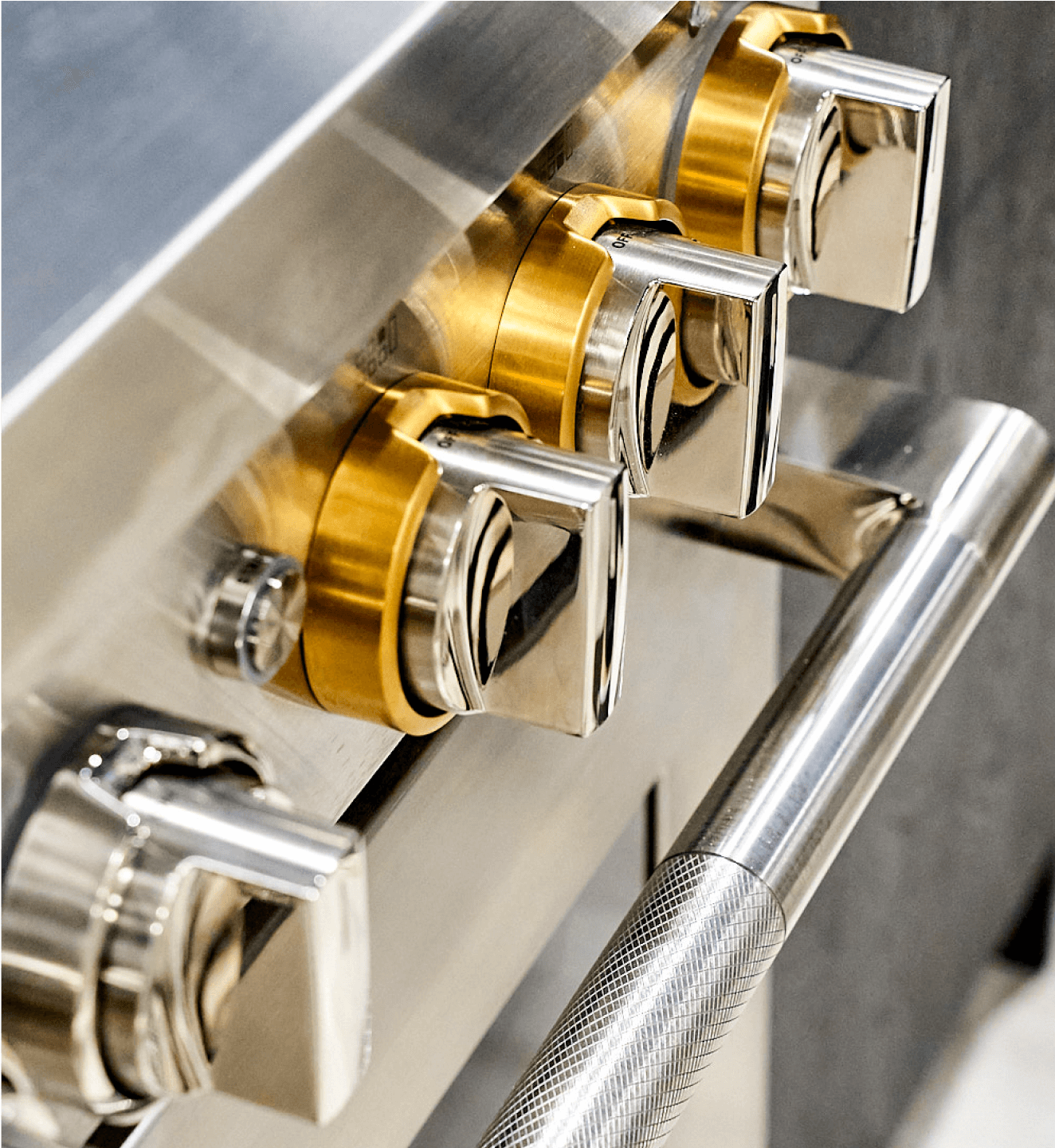 A close up of the halo-effect knobs on the new JennAir® 48-inch induction professional style range.