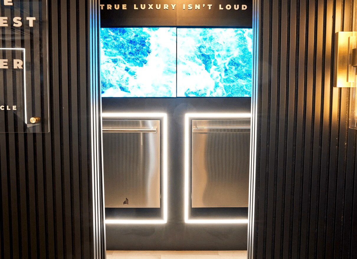 A pair of JennAir® dishwashers installed with perimetric lighting around them.