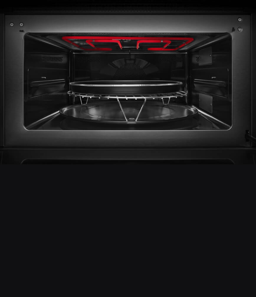The interior of the built-in microwave or speed oven with the grill element activated.