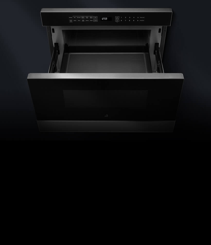 An open microwave drawer.