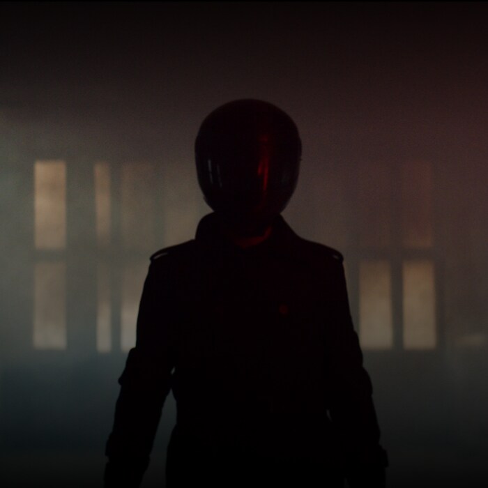 A silhouette of a motorcycle rider. 