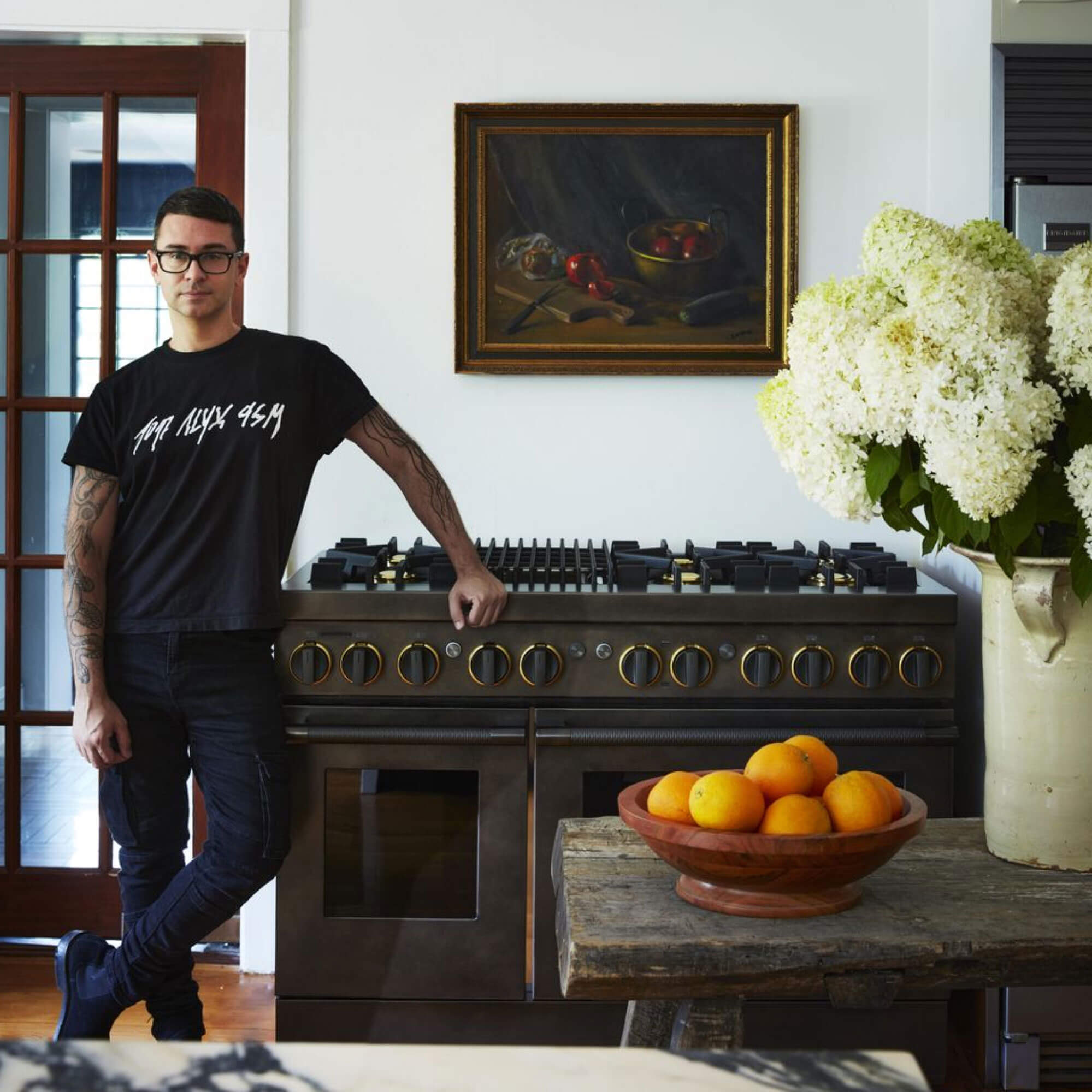 Christian Siriano with the JennAir® Smoke & Brass Range.