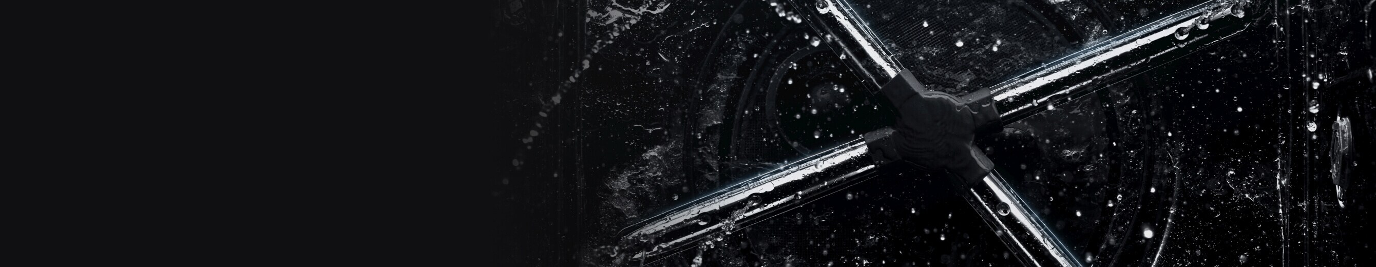 The wash arms inside a JennAir® Dishwasher with water.