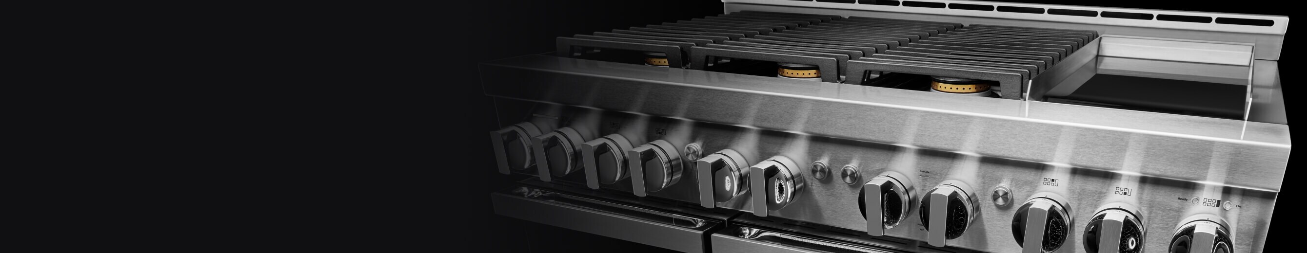 A JennAir® NOIR™ Gas Range with an electric griddle.