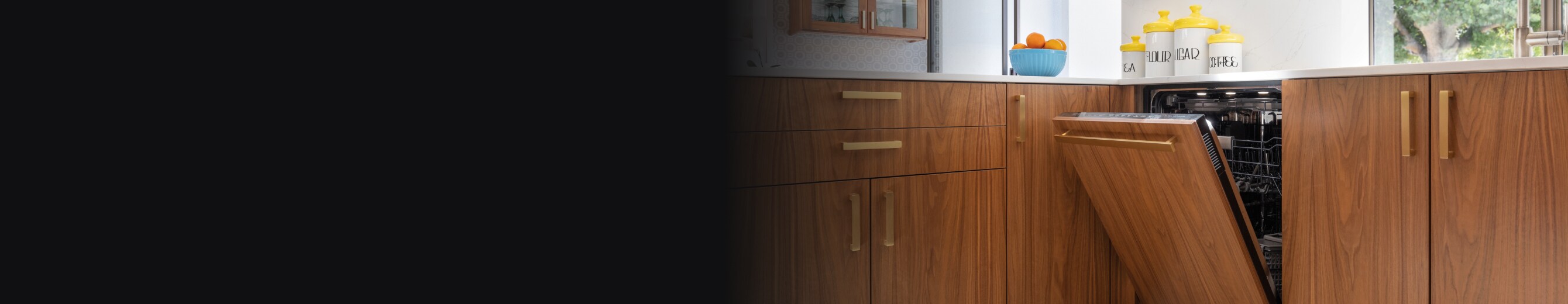A JennAir® Panel-Ready Dishwasher with a wooden exterior