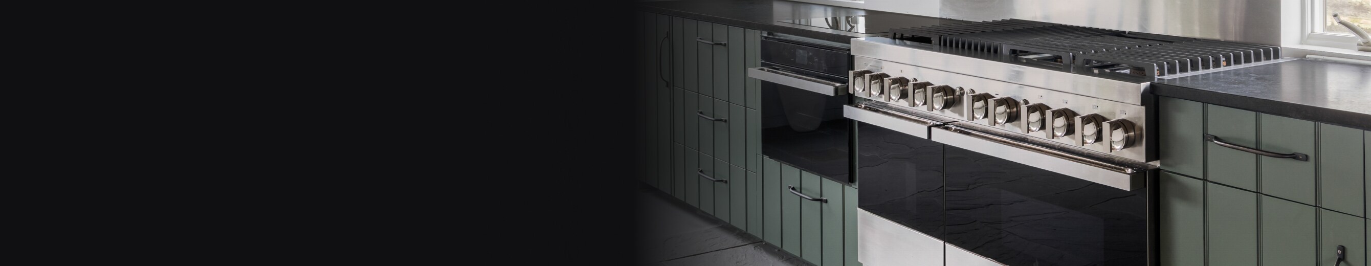 A JennAir® Professional Range against green and striped cabinetry