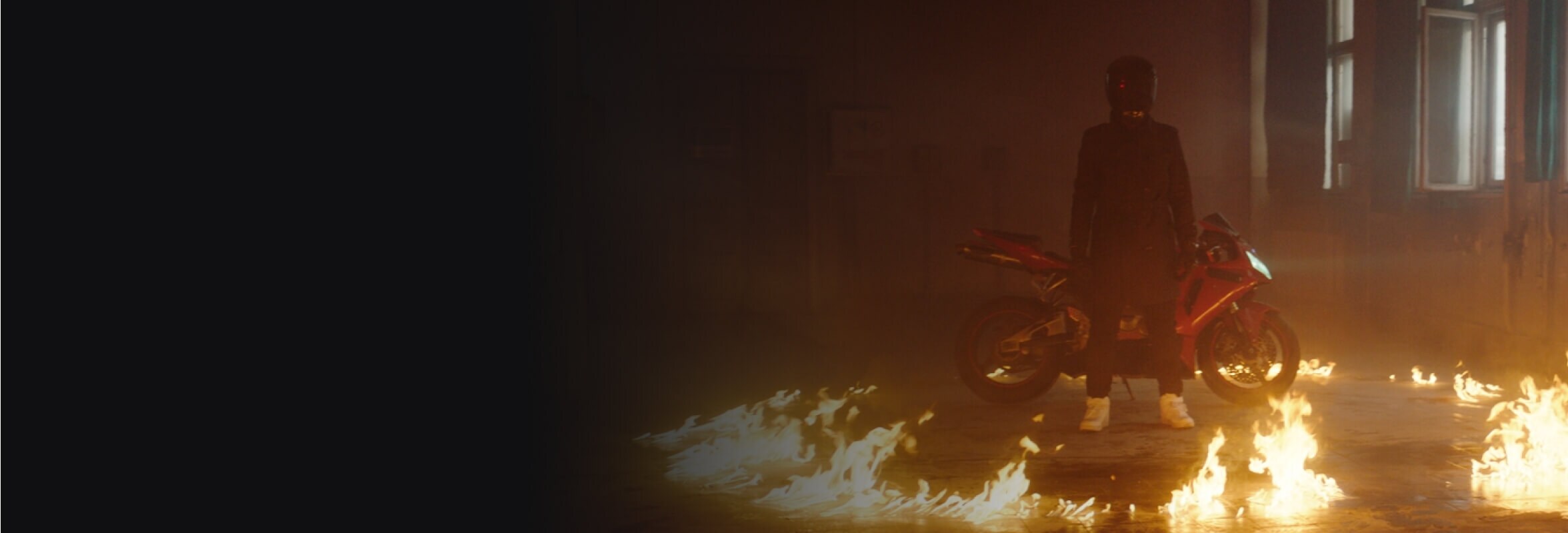 A dancing woman surrounded by pink smoke.