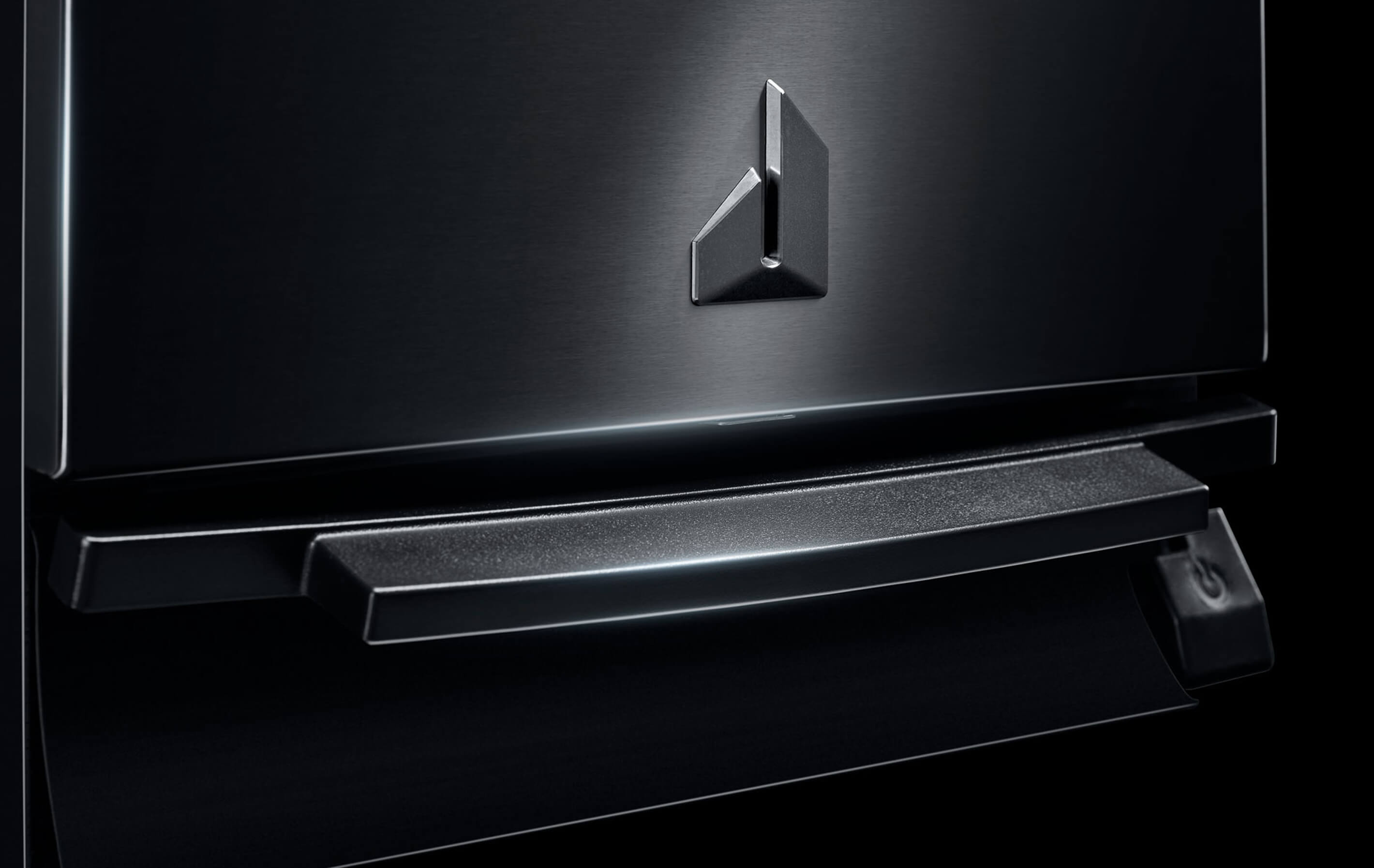 A close-up of the push pedal of a JennAir® Trash Compactor