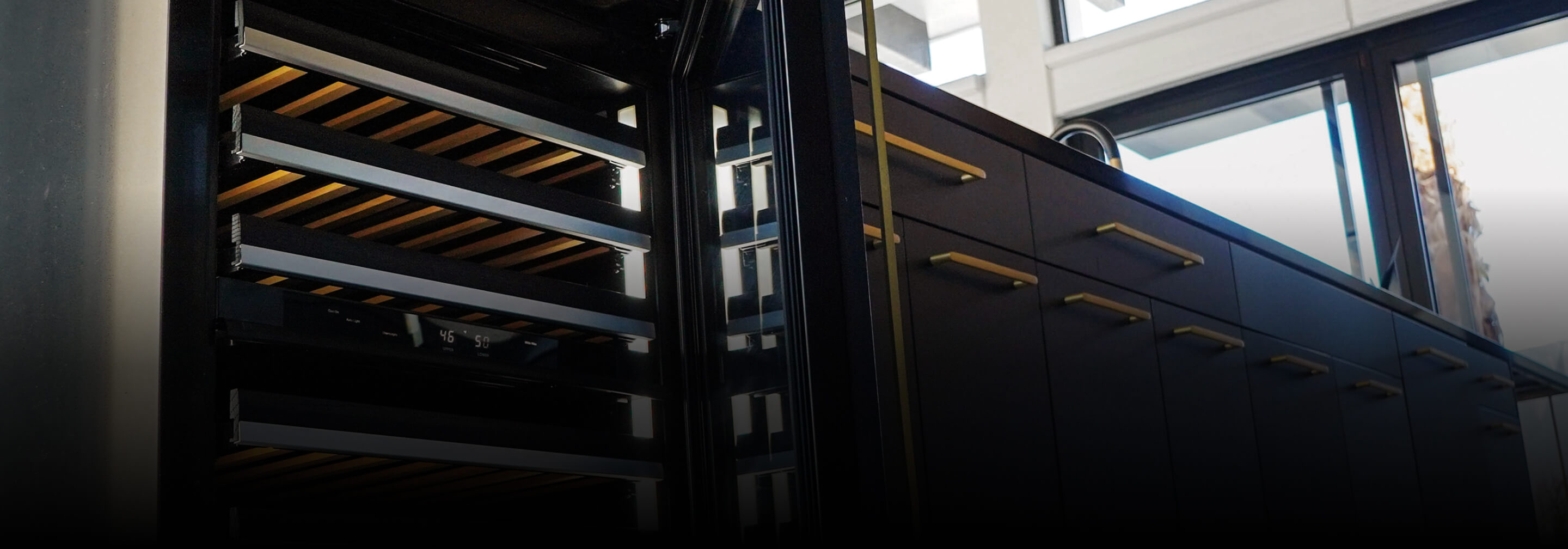 An open JennAir® wine refrigerator with beechwood tines.