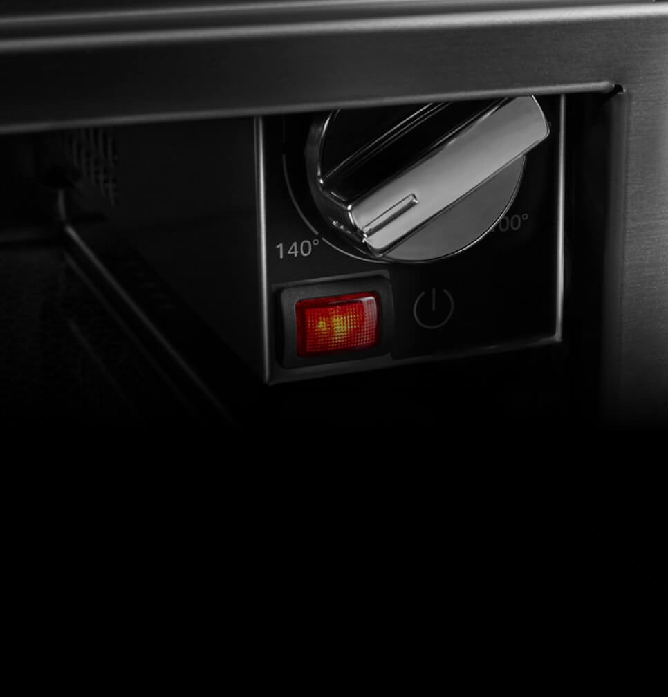 The controls inside of the warming drawer.