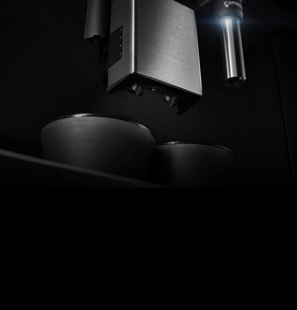 A close up of the coffee maker's dual dispensing spouts.