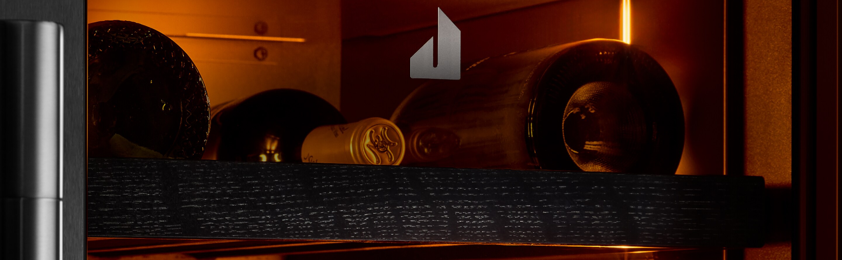 The interior of the JennAir® wine column refrigerator, showing the Ambra Lighting.