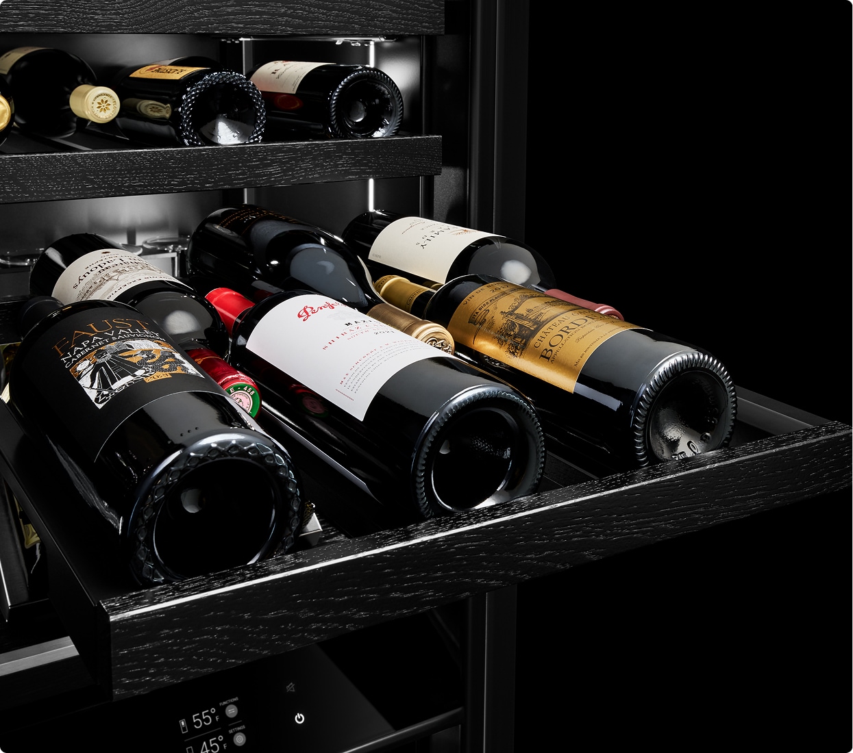 A wine rack pulled out, loaded with six wine bottles.