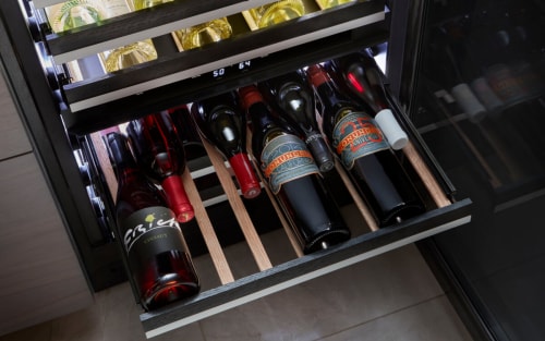 Interior of JennAir® filled wine cellar drawer