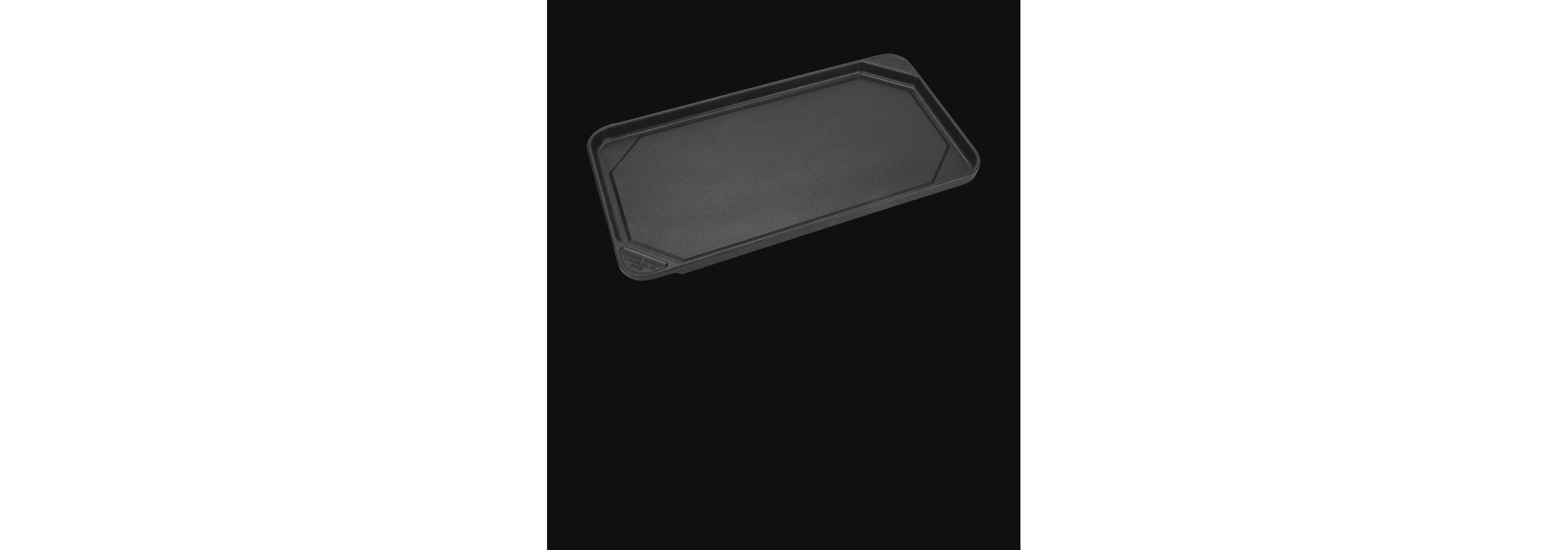 A griddle accessory isolated on a black background.