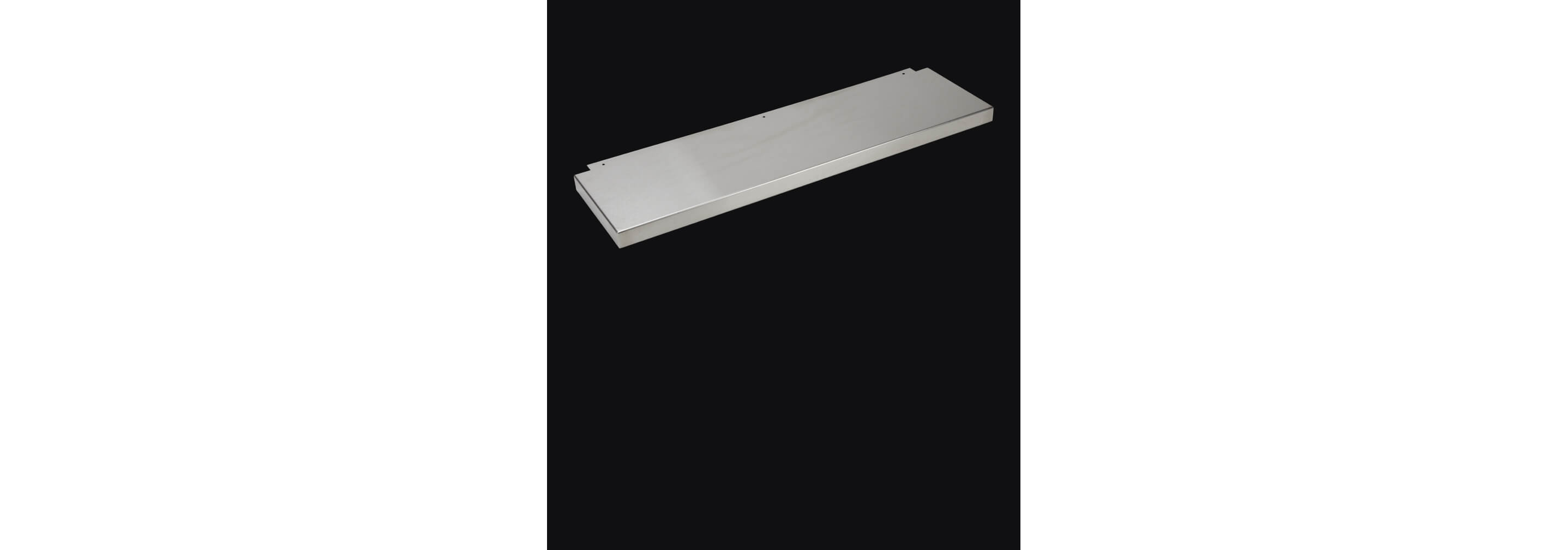 A cooktop backsplash isolated on a black background.