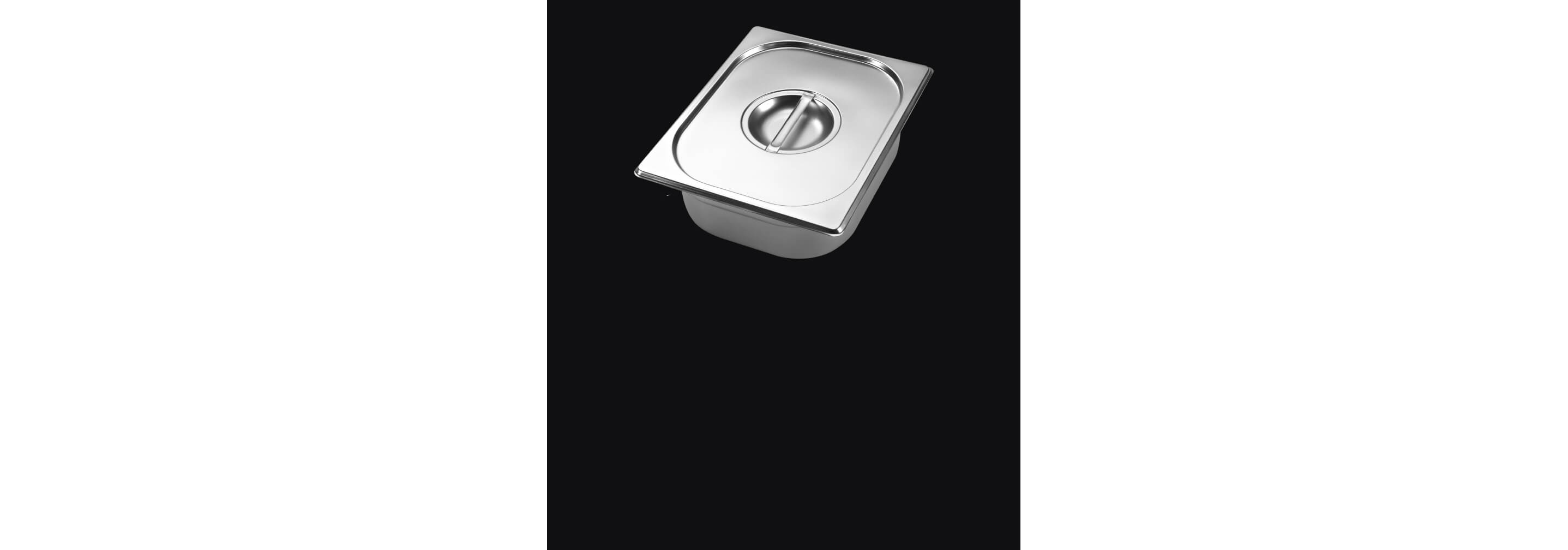 A warming pan with lid isolated on a black background.