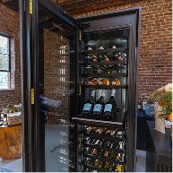 A JennAir® Wine Column stocked with assorted wine