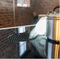 The JennAir® NextGen Downdraft Induction Cooktop in use