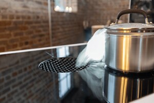 The JennAir® NextGen Downdraft Induction Cooktop in use