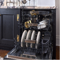 An open JennAir® dishwasher