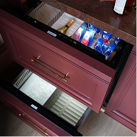 Open JennAir® Refrigerator and Freezer Drawers installed in the bar
