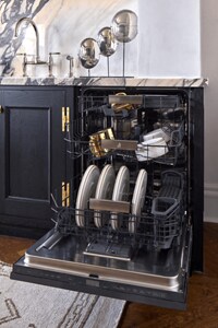 An open JennAir® dishwasher