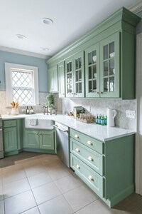 Green cabinets in the bright kitchen