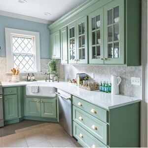 Green cabinets in the bright kitchen
