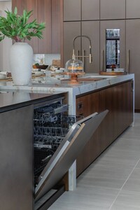 An open JennAir® dishwasher