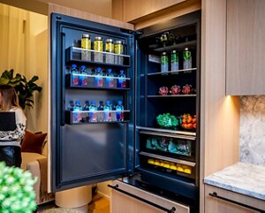An open JennAir® Built-In Refrigerator in the kitchen