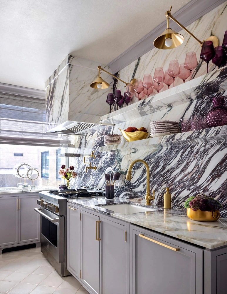 A marble kitchen with JennAir® appliances.