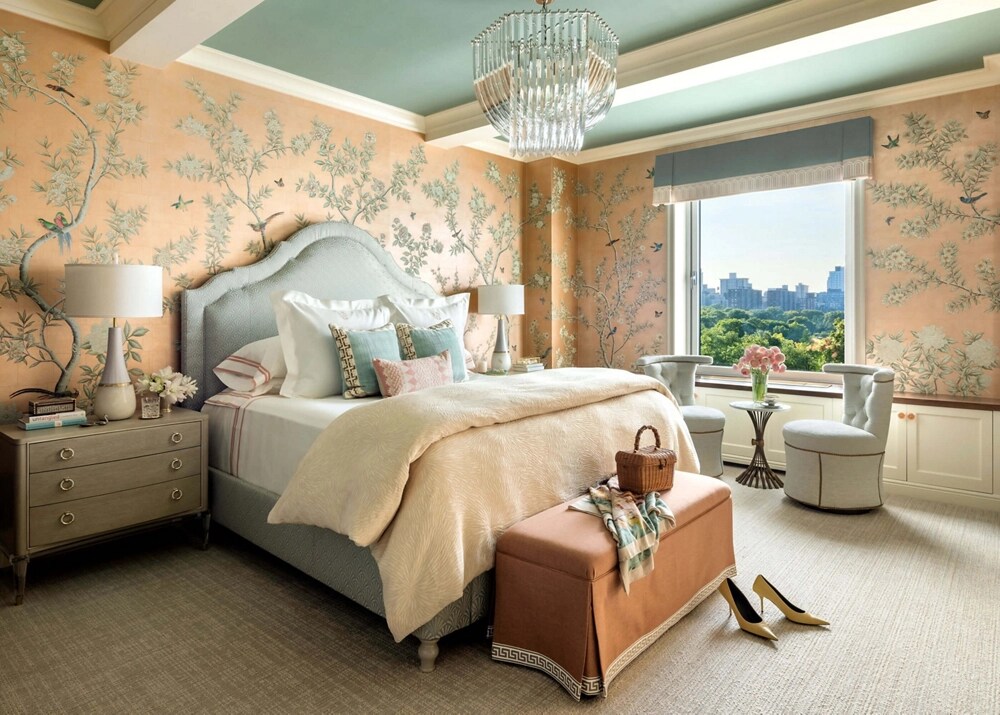 A bedroom with mint and peach colors.