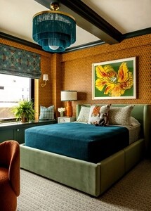 A bedroom with wood paneling and rich blue details.