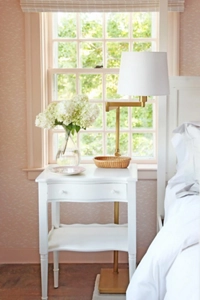 The side table next to the bed in the Purple Bedroom.