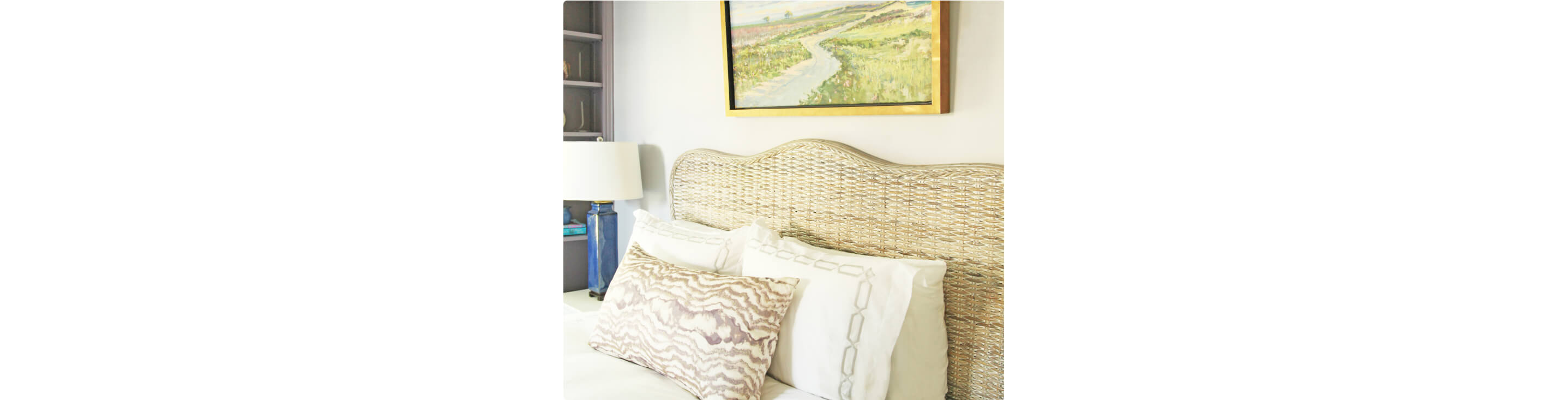 The headboard and bed of the lilac bedroom. 