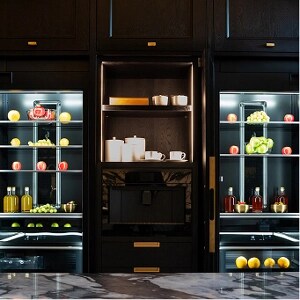 The open JennAir® Column Refrigerators and Freezers behind the island