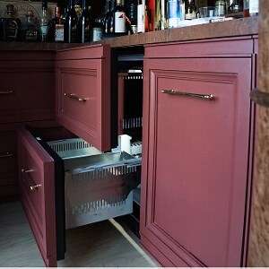 A JennAir® Refrigerator and Freezer Drawer outfitted with maroon custom cabinetry