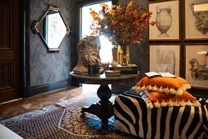 Artwork and textured furniture in a moody room in the Kips Bay Dallas Show House