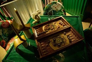 A gaming table with a custom backgammon set