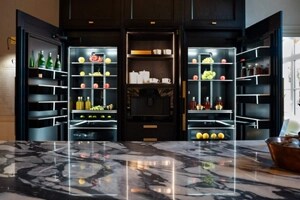 The open JennAir® Column Refrigerators and Freezers behind the island