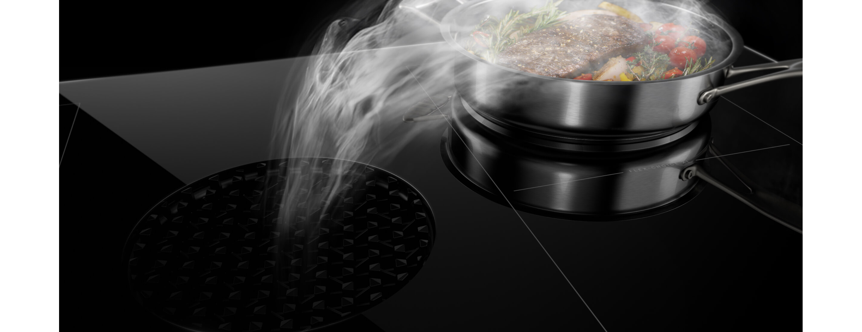 A downdraft cooktop pulling steam away from a pan.