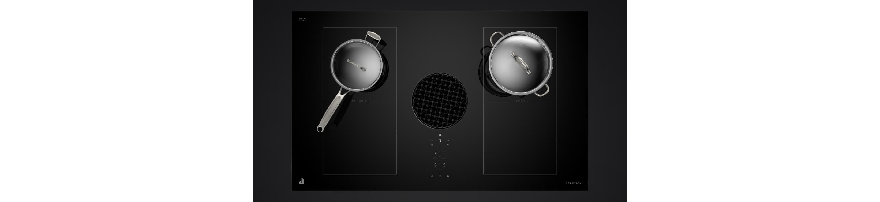 Two stainless pans on a downdraft induction cooktop.