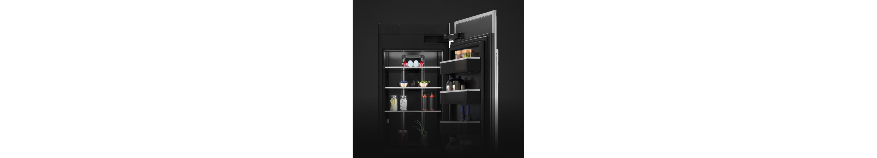An open Column Refrigerator, propped with fine foods, luxury ingredients and high-end dishware. 