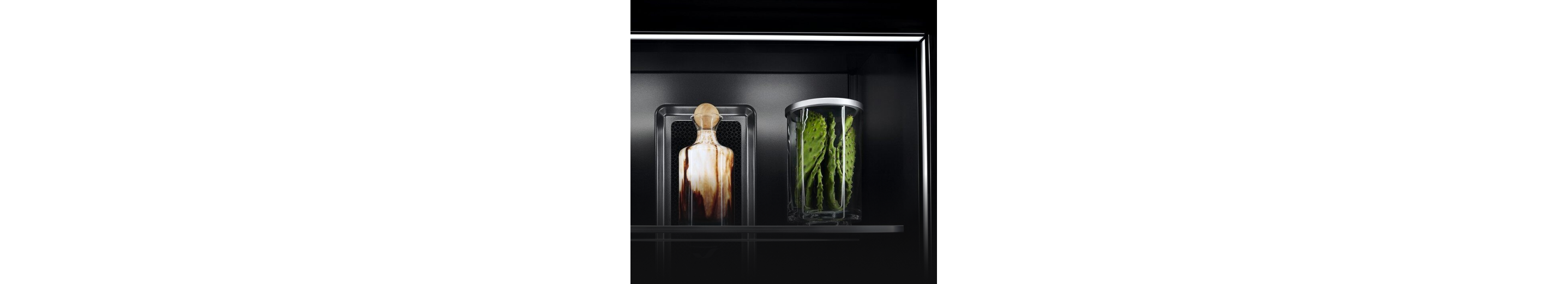 Ecliptic Lighting showcasing fine ingredients in luxury glassware against the Obsidian interior. 
