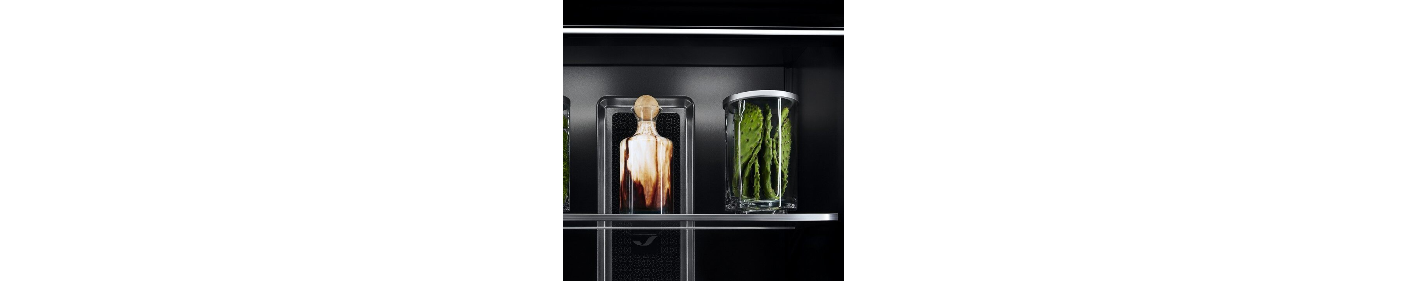 Ecliptic Lighting showcasing fine ingredients in luxury glassware against the Obsidian interior. 