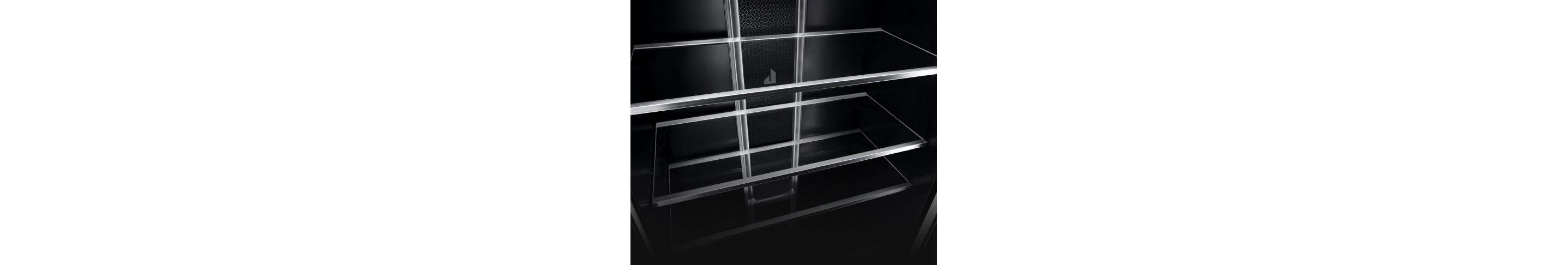 Glass shelves with metal trim in the interior of a JennAir® Column Refrigerator.