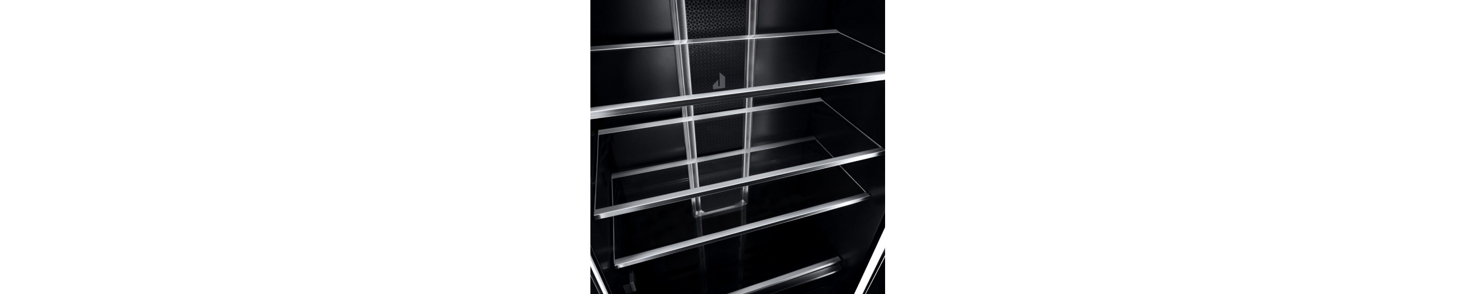 Glass shelves with metal trim in the interior of a JennAir® Column Refrigerator.