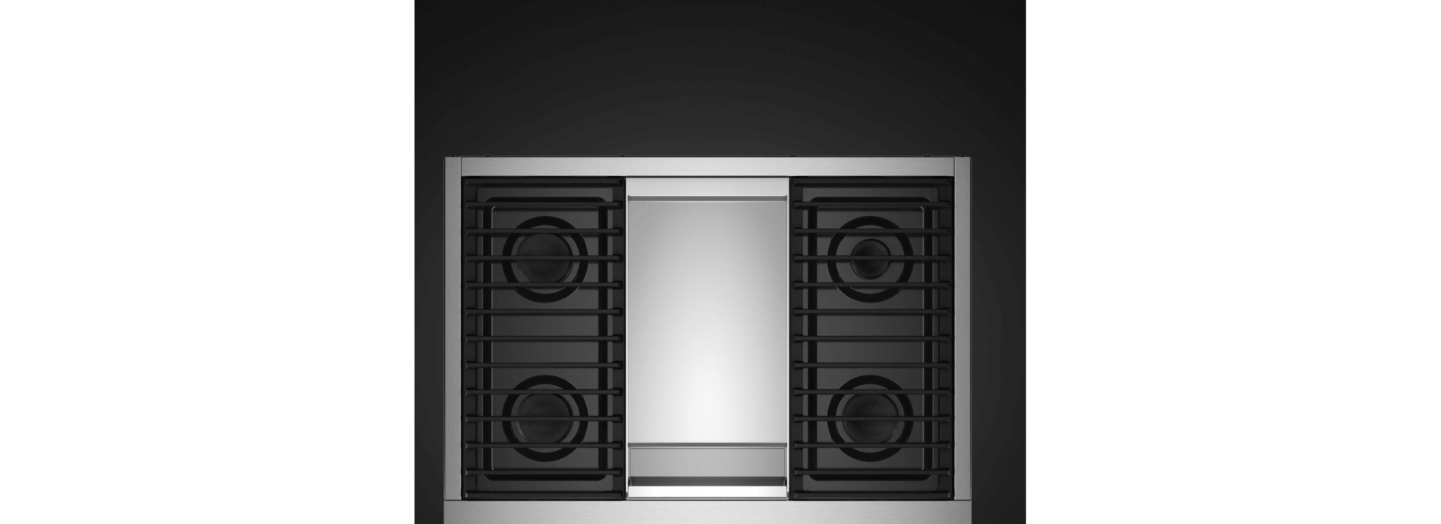 A top-down view of a range with a Chrome-Infused Griddle.
