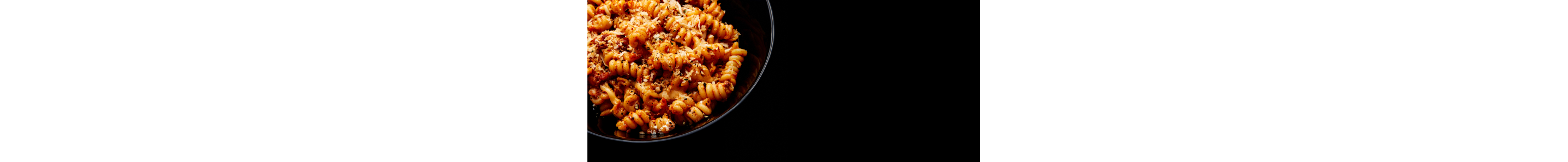 Plated food on a black surface.